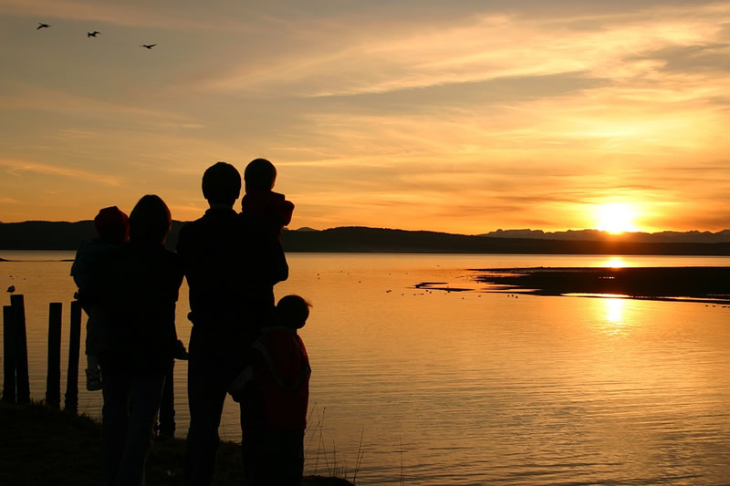 Family traveling and enjoying a sunset abroad