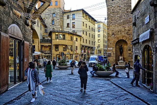 A street with people walking in Florence, Italy.