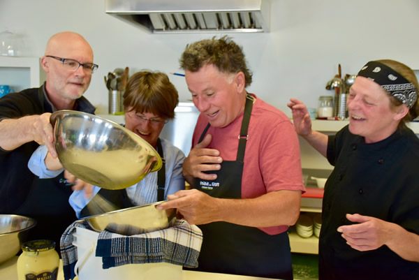 Students preparing sauce during the scallop workshop of 'Gourmande de Nature'