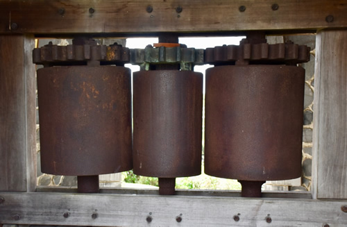 Old sugar cane press at Trois Rivières Distillery.