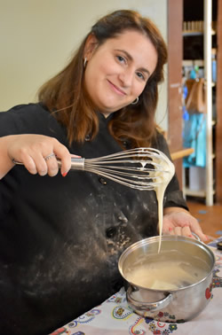 The teacher is making the custard in Porto.