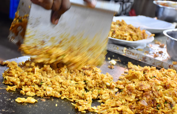 Chopping ingredients for a kottu