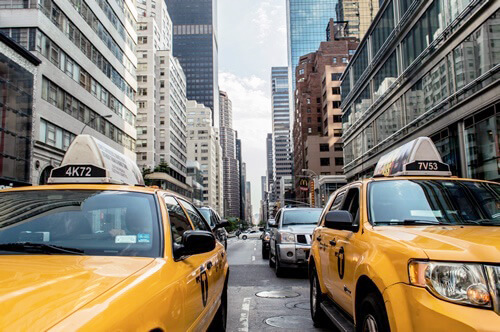 Hearing the sounds of the city, and taxis, in New York City in traffic.