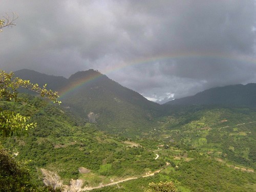 Landscape with rainbow through in the mountains of Guatemala.