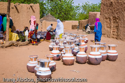 Hand-made clay pots for water at the market.