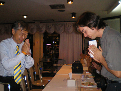 A local Community Elder and the author bow to each other with respect.