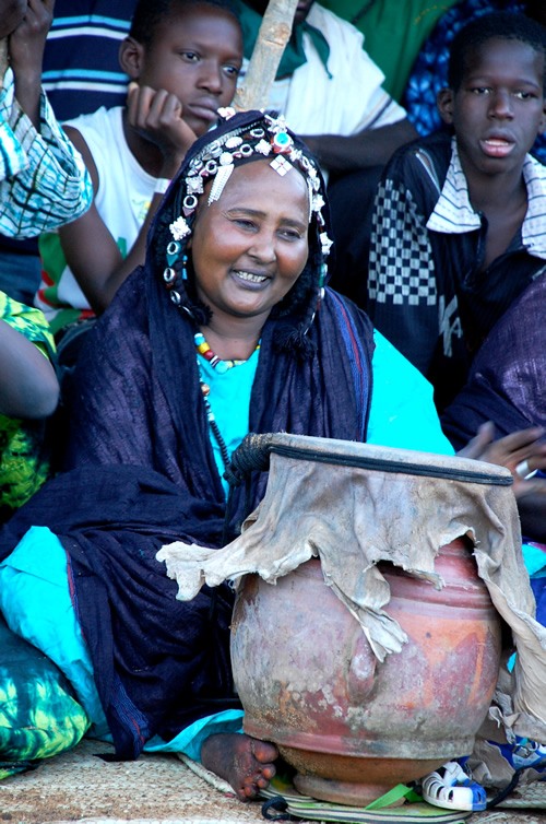 Festival: Woman with drum.