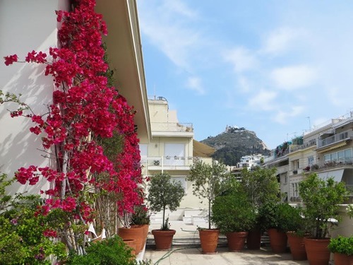 Kolonaki Benaki Museum with Lycabettus hill in background.