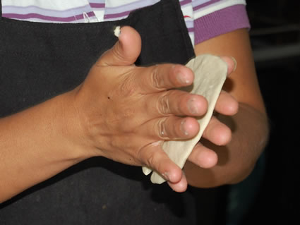 Rolling a tortilla at the cooking school.