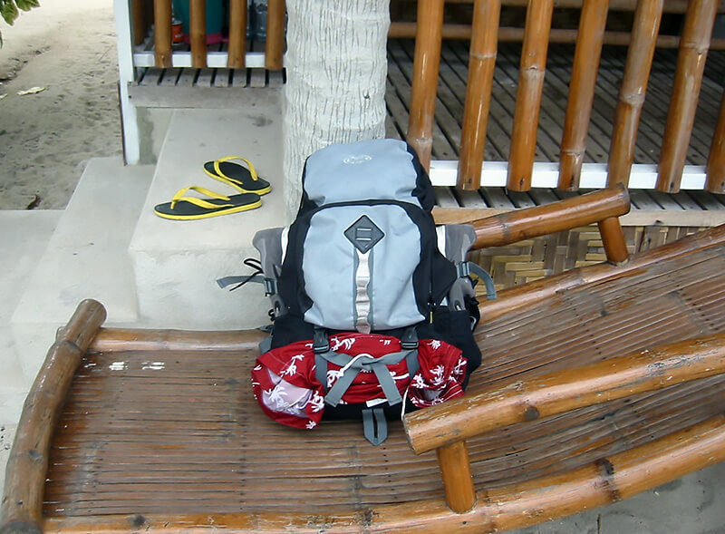 Pack light, travel light. A compact backpack here posed on a lounge chair.