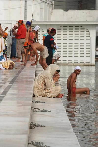Bathing in Amritsar River, India.