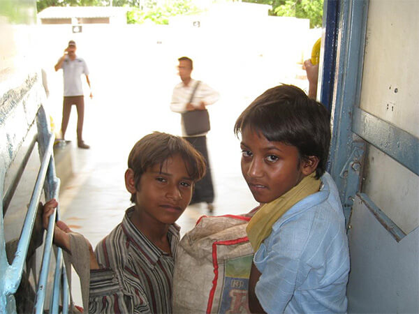 Little boys on train in India.