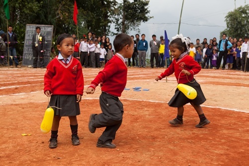 Children playing a balloon game in Himalyas.