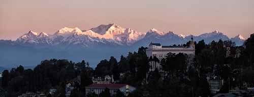 Himalayan landscape with mountains in background of village.