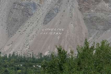 Long live Pakistan inscribed in English on a huge mountain cliff.