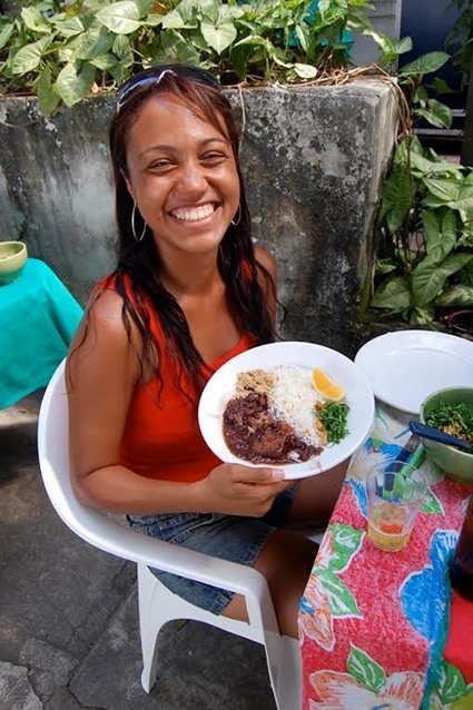 Enjoying a feijoada in Brazil.