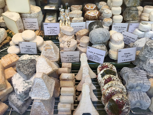 Cheeses in at a cheese shop in Paris.