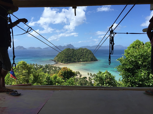 Adventure island-hopping, here in ziplining in Palawan, Philippines.