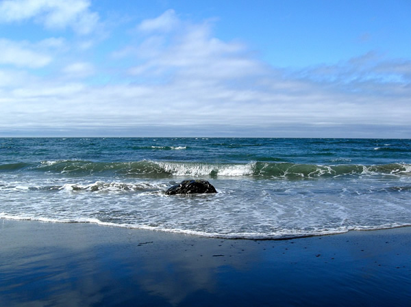 Mystic beach with waves coming in.