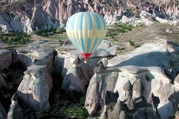 Volcanic rock is dramatically sculpted by wind and weather and best seen by hot air balloon.