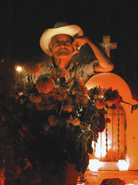 Man at a cemetary in Oaxaca, Mexico.