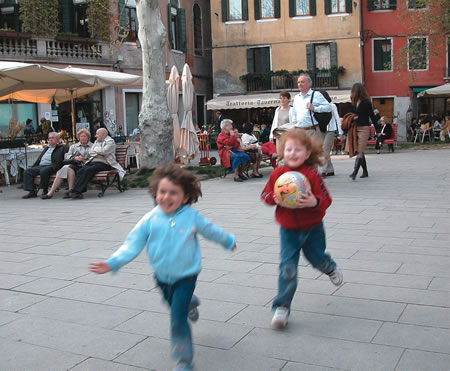 Girls running in Venice.