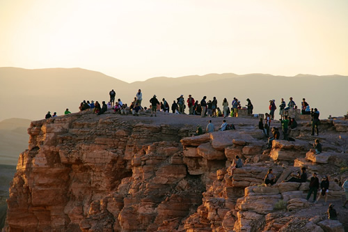 Learning Spanish in a crowd on a cliff.