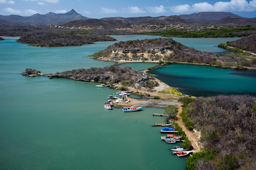 Travel by boat along the bay in Curacao.