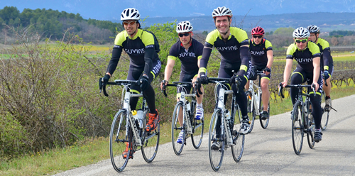 DuVine tour guides riding bikes in the countryside.