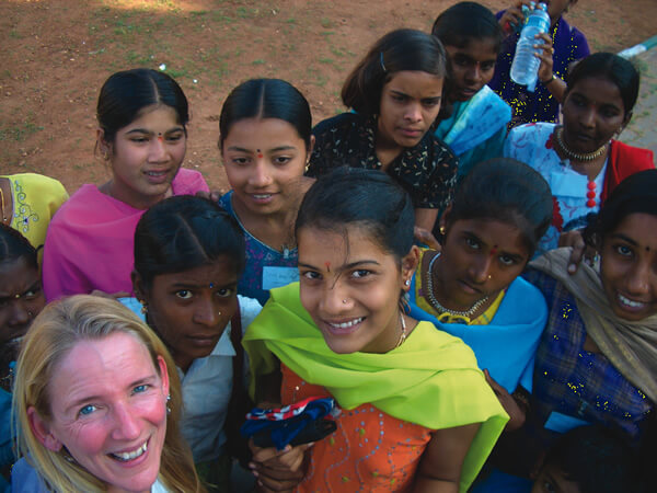 Beth Whitman in India with local women.