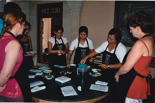 Chef with group of cooking school students in Bali.