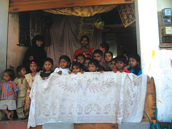 Children in India with teachers in class.